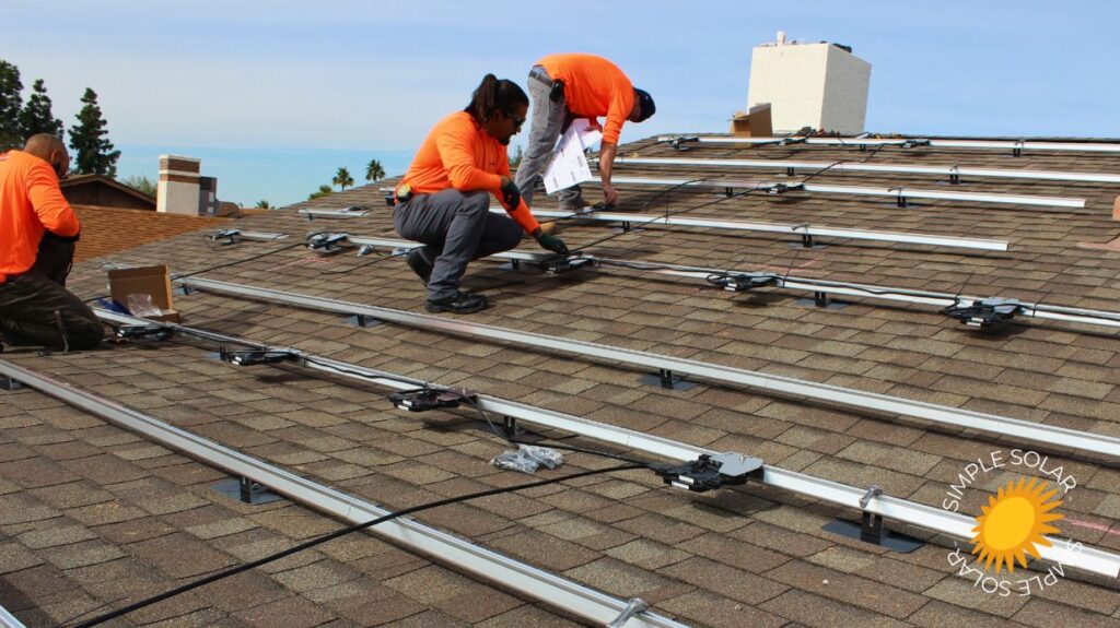 men checking maintenance of solar panels