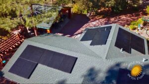 Drone view of a shingled roof in Arizona with a solar panel array installation installed by Simple Solar