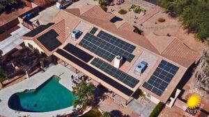 Birds eye view of a solar array installation done by Simple Solar in Glendale Arizona on a tile roof with a pool visible in the backyard